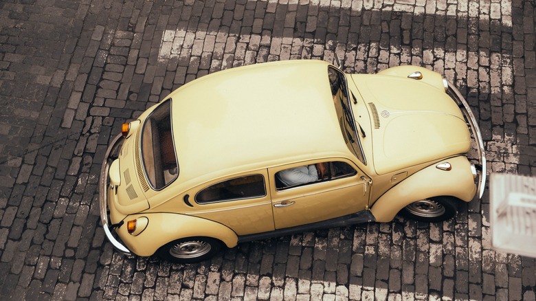 Vintage Volkswagen Beetle driving in Peru