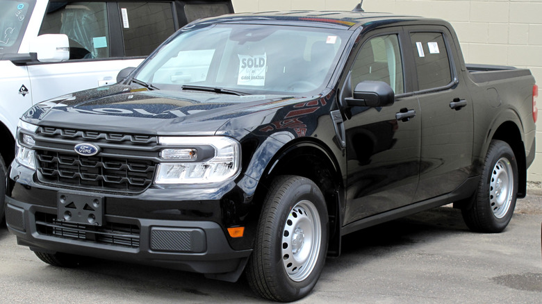 A parked black 2022 Ford Maverick XL.
