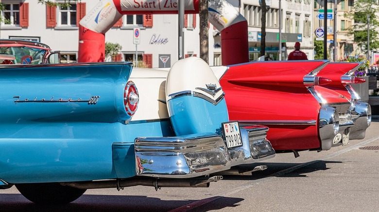 The extravagant tail fins on a Ford Fairlane and Cadillac.
