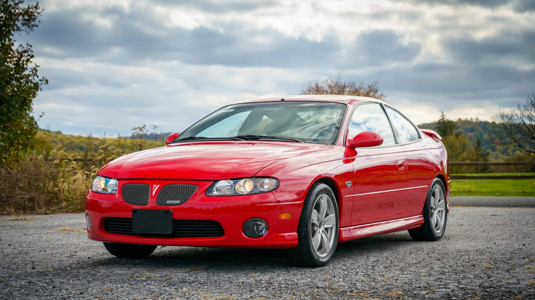 A red 2006 Pontiac GTO on a parking lot.