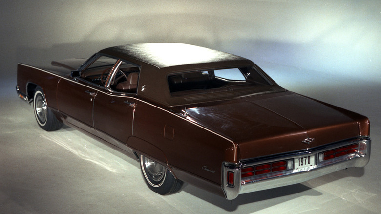 An unfortunate brown 1970 Lincoln Continental sporting deep dish wheels and a brown sim top.