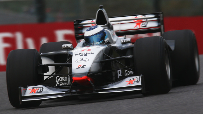 Mika Häkkinen in his 1998 championship-winning McLaren MP4/13, a car that greatly benefited from beryllium internals.