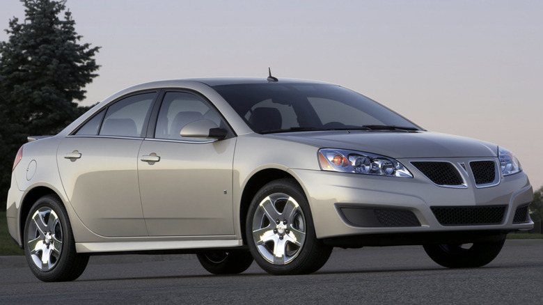 A pontiac g6 parked on pavement