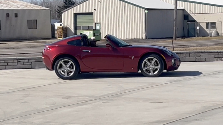 A red Pontiac Solstice GXP Coupe