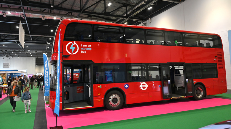 BYD's red double-decker London bus parked on display.