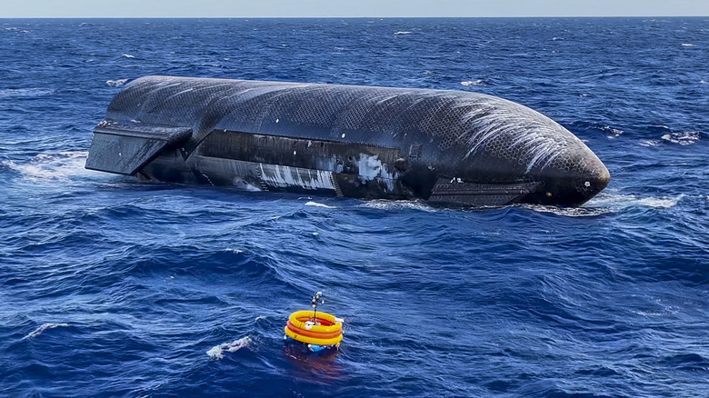 The upper stage from Starship Flight 13 bobbing in the Indian Ocean with visible white streaks