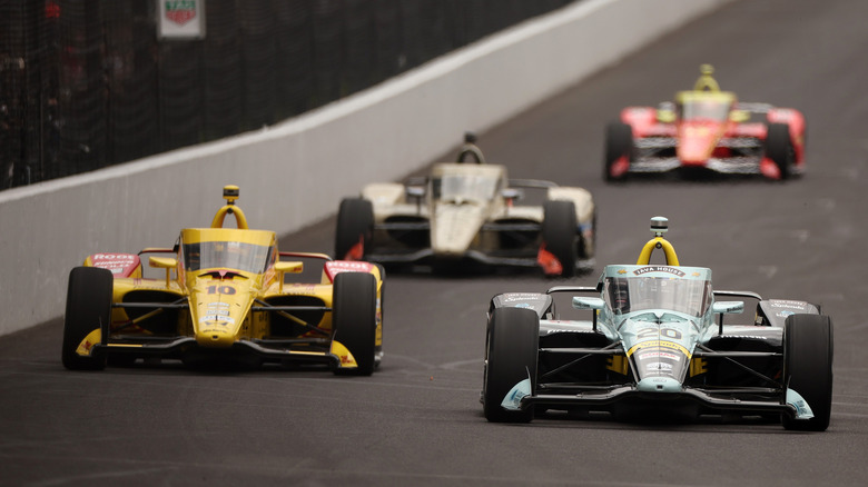 Alexander Rossi, driver of the #20 ECR Chevrolet leads Alex Palou, driver of the #10 Chip Ganassi Racing Honda during the NTT IndyCar Series 110th Running of the Indianapolis 500 at Indianapolis Motor Speedway on May 24, 2026 in Indianapolis, Indiana.