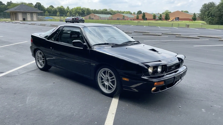 A 1991 Isuzu Impulse RS parked in a parking lot