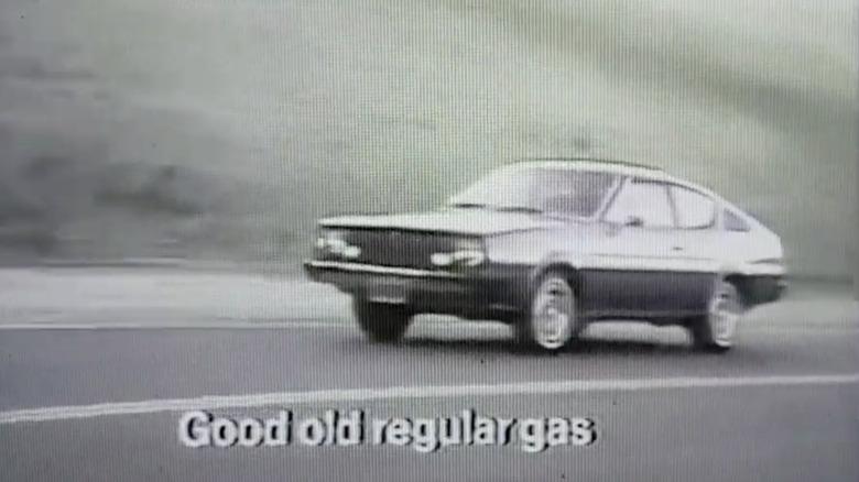 an image of a plymouth arrow driving down the road pulled from a 1977 commercial