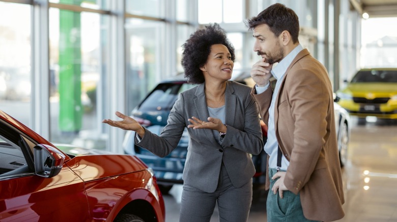 A woman trying to persuade her husband to buy car