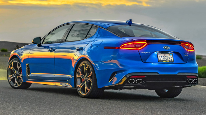 A rear three-quarter view of a blue 2021 Kia Stinger GT2.