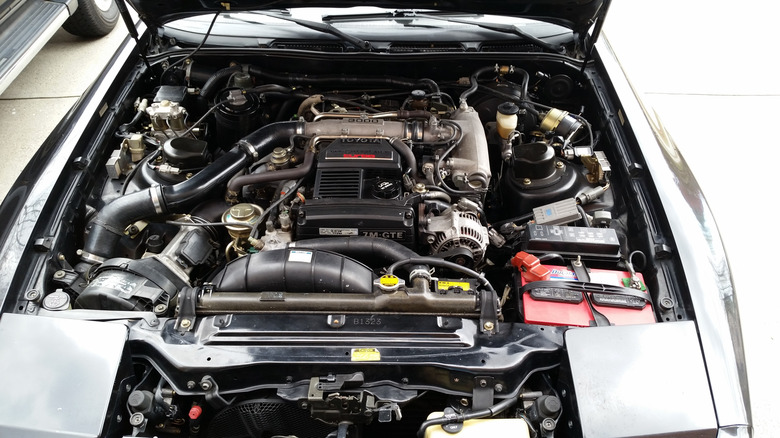 Still image of an A90 Supra's engine bay, and the 7M-GTE straight-six.