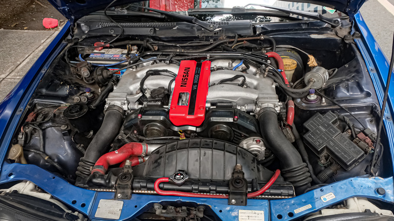 Open-hood shot of a Nissan VG30DETT V6.