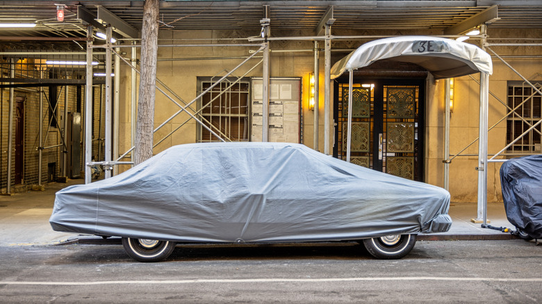 A car with a car cover on top of it.