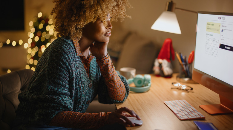 A woman reviews options on a website.