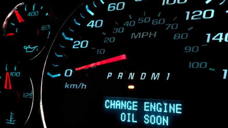 A dashboard message says to change engine oil soon.